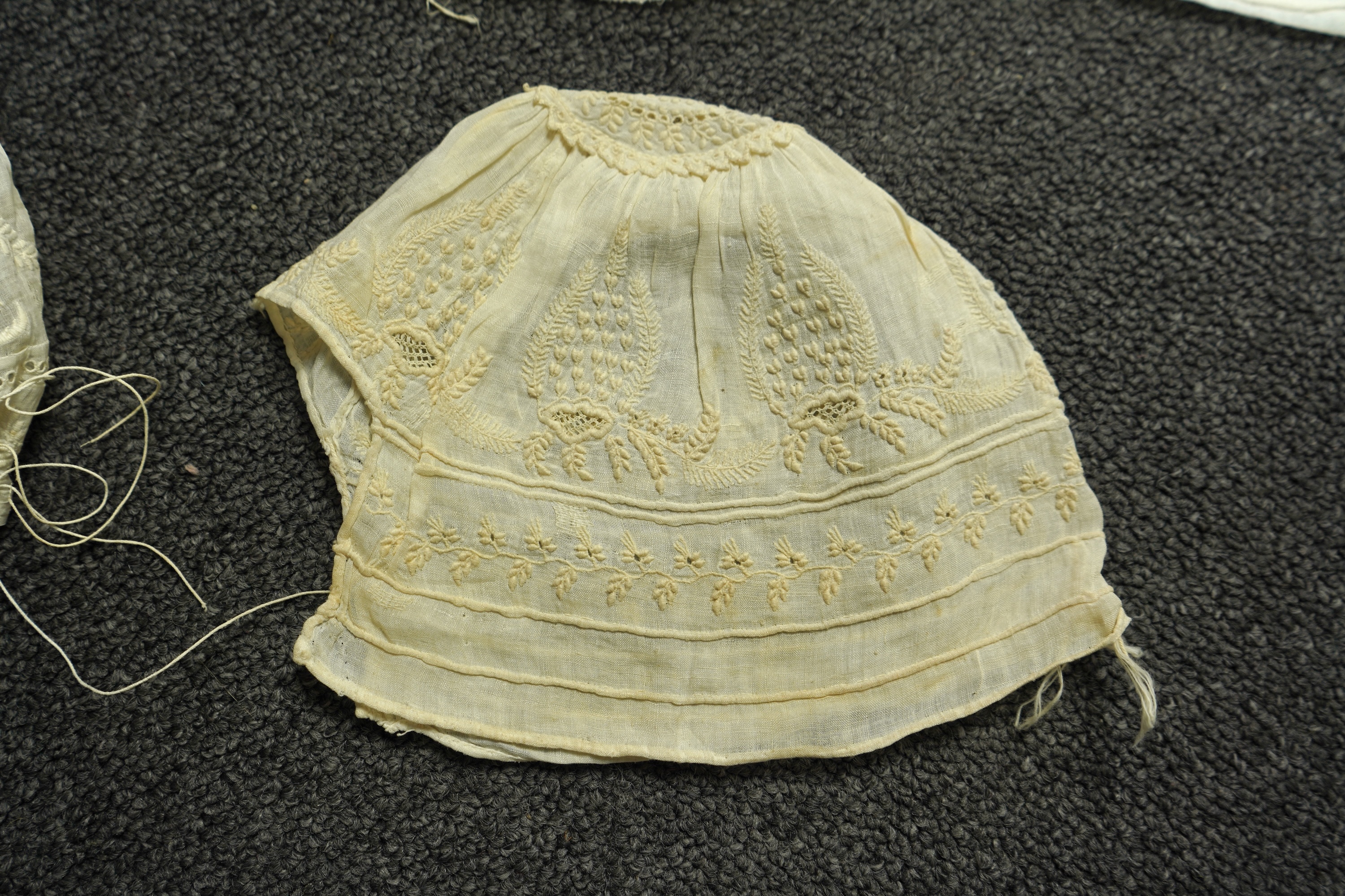 A collection of six baby’s bonnets from the mid 18th century to the late 19th century. An 18th century Hollie Point inserted baby bonnet, a quilted 18th century baby bonnet, two white work bonnets with needle lace crown